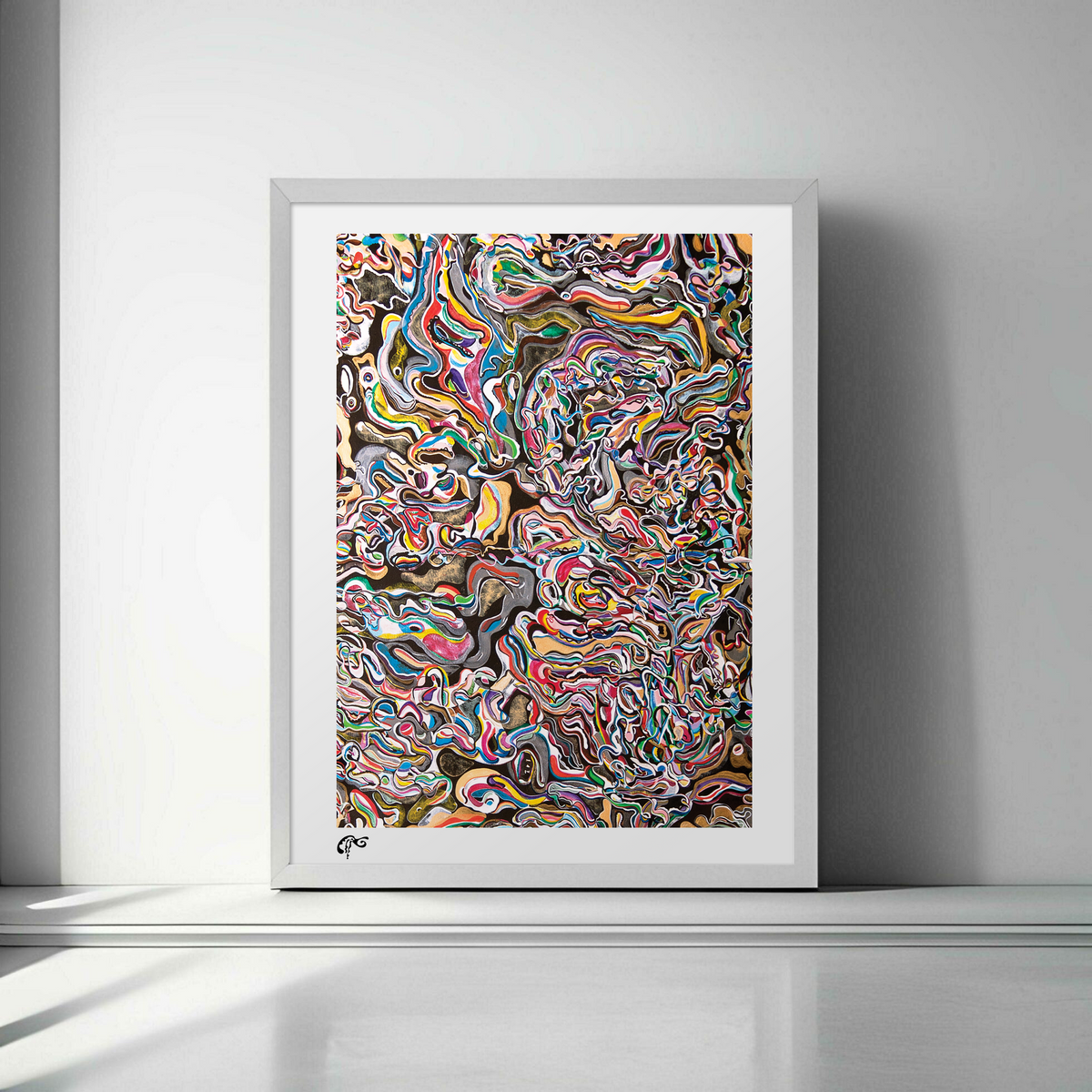 Framed abstract artwork with multicolored patterns on a gray wall.